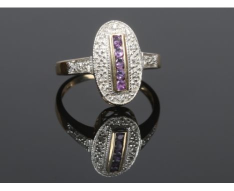 An Art Deco style 9ct gold ring set with amethysts and diamonds over a pierced gallery, size M.