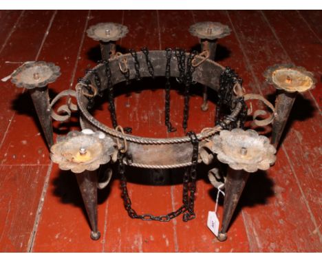 A six branch cast iron ceiling light.