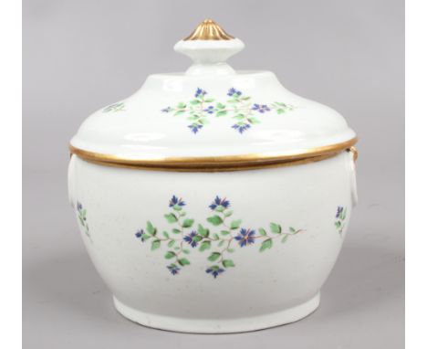 A Derby / Pinxton oval sucrier and cover with reeded knop finial and moulded ring handles. Edged in gilt and painted with pol