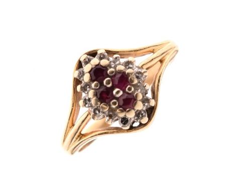 Dress ring set diamonds and four ruby coloured stones, the shank stamped 14K, size K½, 2.8g approx   Condition: 