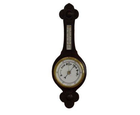 Early 20th Century carved oak cased aneroid barometer and thermometer   Condition: 