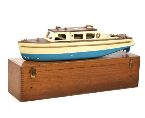 Vintage steam-powered scale model of a river cruiser with wooden cabin and deck enclosing spirit-fired boiler, cream-painted 