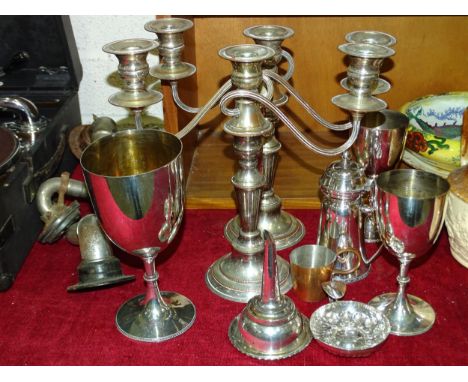 A pair of plate three-light candelabra, 27.5cm high, a plated wine funnel and other plated ware. 