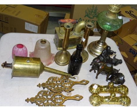 A pair of brass covered iron door stops, a pair of brass trivets, a brass clockwork rotisserie/spit jack and a collection of 