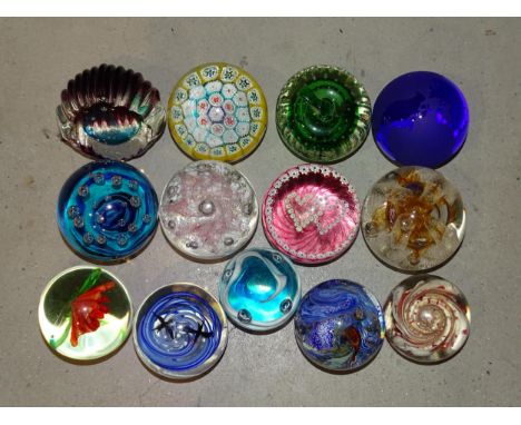 A collection of thirteen glass paperweights, including three by Caithness: 'Sea Pearls', 'Congratulations' and 'Luckenbooth',