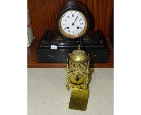 A black slate mantel clock, the drum movement marked H, striking on a bell, 23.5cm high, 29cm wide, together with a modern Sm