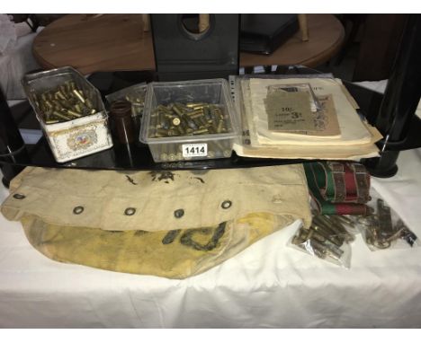 A collection of Militaria including quantity of used ammunition from .44 Magnum, badges, bag &amp; belt etc.