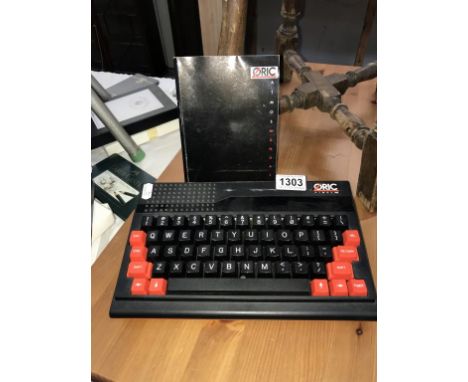 An Oric Atmos 48k  computer and manual (no leads, untested, but appears in good condition)