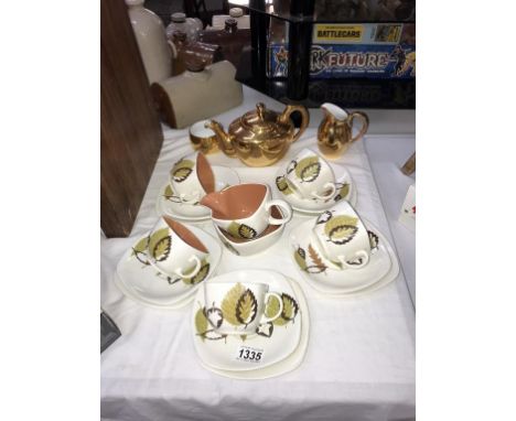 A T.G Green 'Central Park' by Colin Haxby tea set (some crazing to some pieces) and a Royal Worcester gilded teapot, milk jug