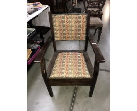 An Edwardian mahogany commode armchair with tapestry paneled seat &amp; back