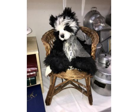 A Charlie Bears black and white Quentin bear plus a vintage cane chair ****Condition report**** The Bear has both its tags