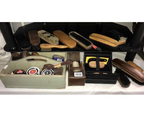 A good selection of vintage shoe brushes, polishes etc
