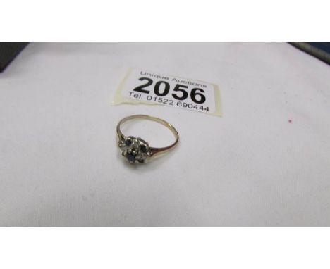 A 9ct gold cluster ring, size P.