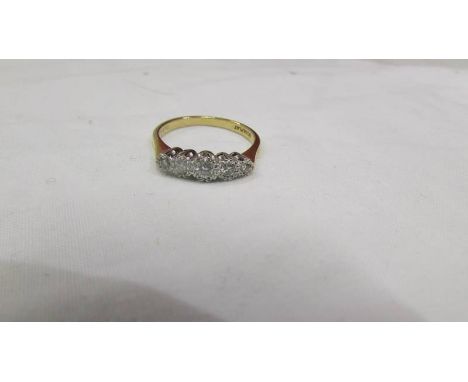 An 18ct yellow gold five stone diamond ring, size O.