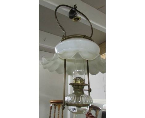 A hanging oil lamp with glass font.  (collect only). ****Condition report**** 2cm crack on front coming from collar.Shade loo