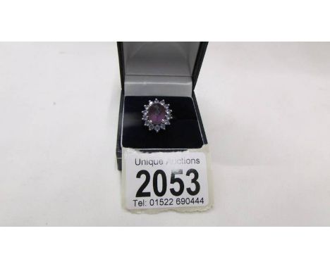 A cluster ring marked 14KW and MB, size O.