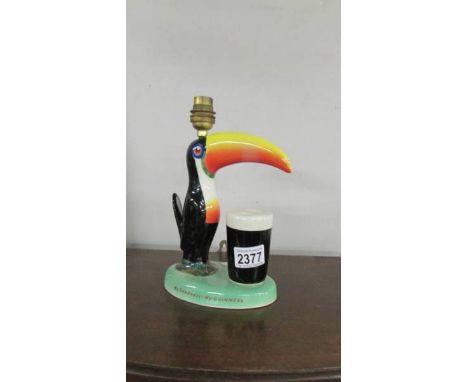 A Carlton War Guinness toucan table lamp base (needs wiring).