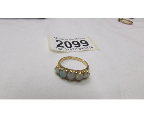 An 18ct gold ring set five opals, size M.