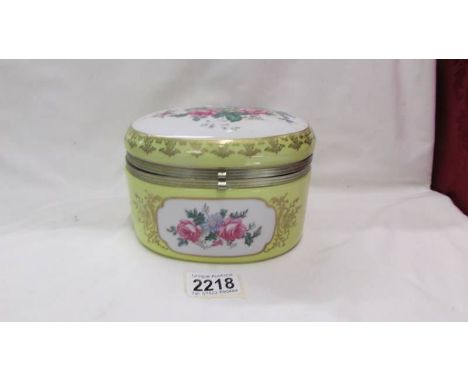 A floral decorated ceramic box.