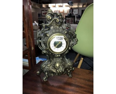 An antique brass plated spelter ormolu mantle clock