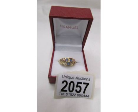 A 9ct gold ring set blue and pink stones, size T.