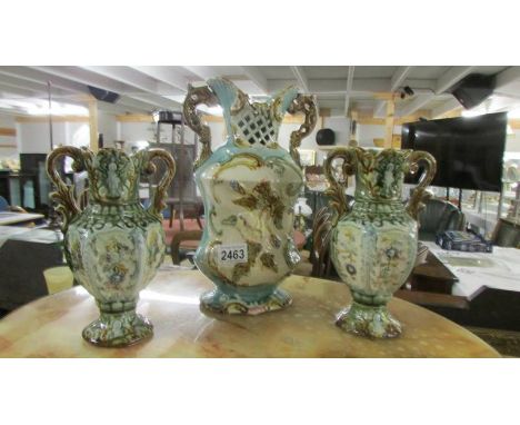 A pair of ceramic vases and one other. ****Condition report**** No Makers mark