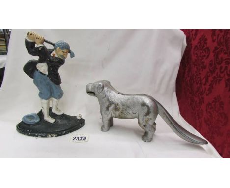 A cast metal dog nut cracker and a golf related door stop.