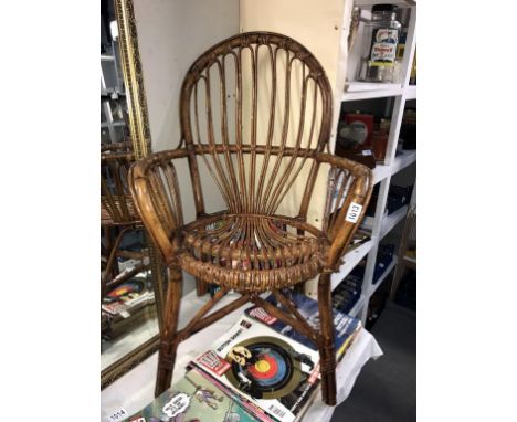 A vintage bamboo/cane arm chair