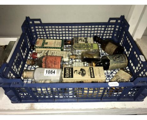 A quantity of vintage bottles with various advertising labels including Sloans liniment etc.