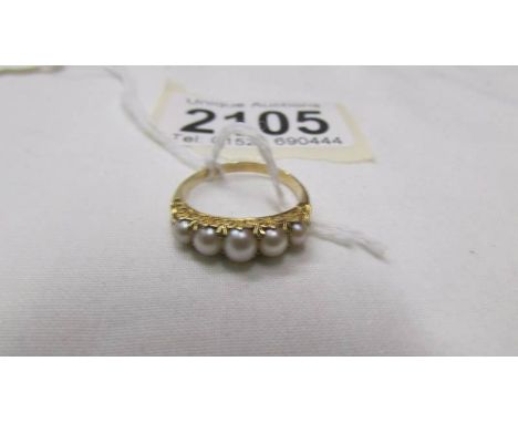 A yellow metal ring set five pearls, size M. (tests as 18ct gold).