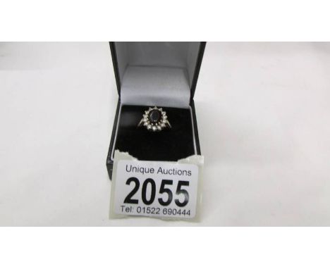 A 9ct gold cluster ring, size P.