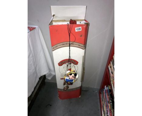 A boxed Bob Baker Pinocchio 60th Anniversary marionette puppet (no stand) strings are tangled