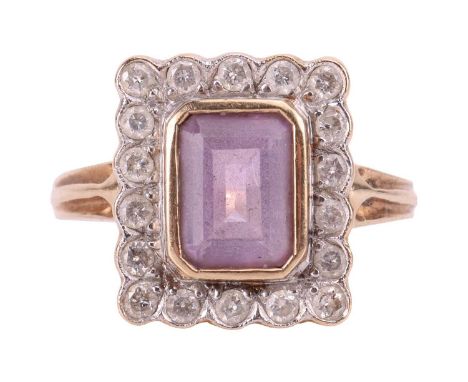An amethyst and diamond cluster ring in 9ct gold, centred with a light purple step-cut amethyst with canted corners, 8.0 x 6.