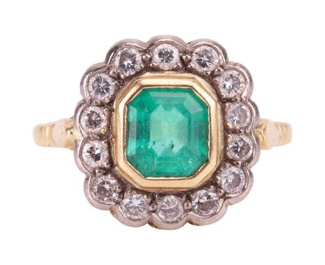 An emerald and diamond cluster ring, centred with a step-cut emerald of vivid green colour, of approximately 6.9 x 6.3 x 4.2 