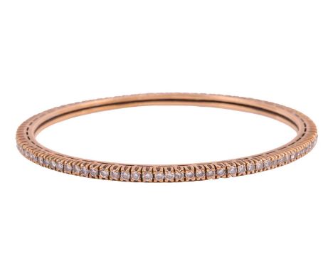 A diamond set closed bangle, estimated total diamond carat weight 2.78ct, pavé set in yellow metal testing as 18ct; Inner dia