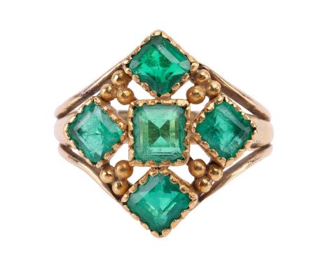 A 19th century Spanish Colonial style emerald dress ring, the lozenge shaped centre set with five mixed step-cut emeralds, th