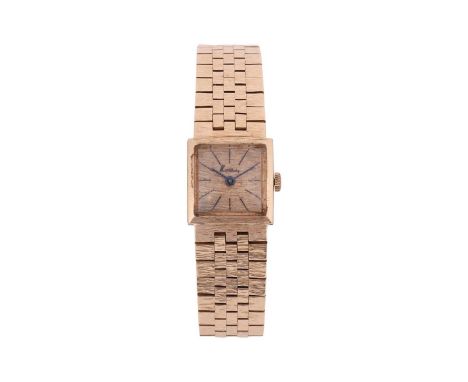 Kutchinsky – A 1960s lady’s 9ct gold dress watch, featuring a brushed gold dial with black baton numerals, signed Kutchinsky,