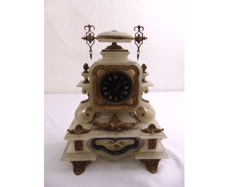 A marble mantle clock of stepped rectangular form the black enamel dial with gilded Roman numerals, two train movement to inc