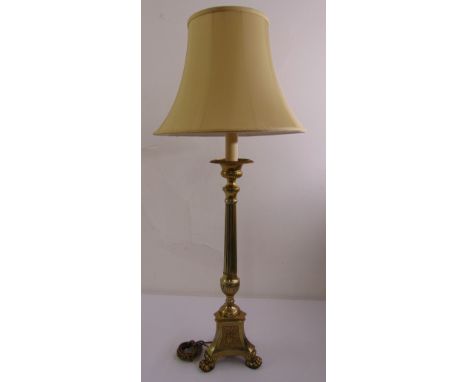 A gilded metal Corinthian column lamp stand and silk shade