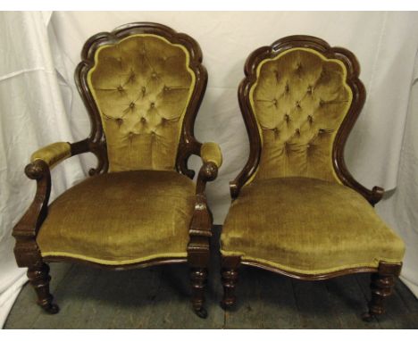Two Victorian mahogany button back upholstered chairs on four turned legs