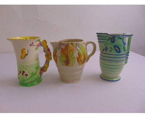 Clarice Cliff Newport Pottery Celtic Leaf and Berry pattern flower jug and two Burleigh ware jugs