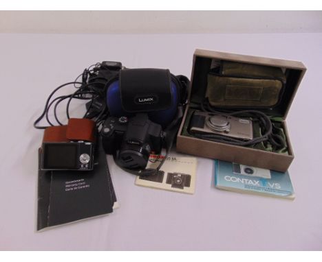 A quantity of cameras to include a Leica C- lux 2 with leather case, a Luminex Minox flash and a Contax camera