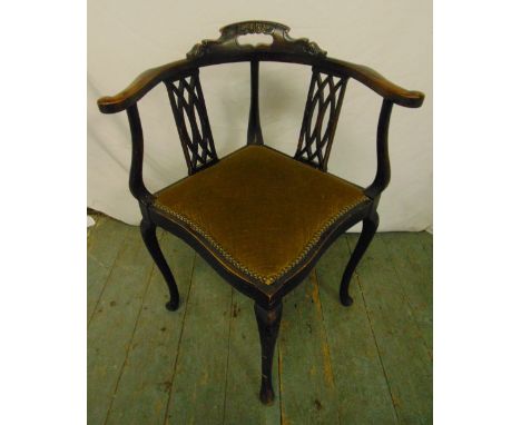 An Edwardian mahogany corner chair with pierced slats, upholstered seat on cabriole legs