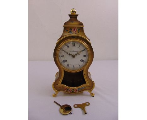 La Parisienne mantle clock lacquered case with flower and leaves, two train movement, white enamel dial with Roman numerals t
