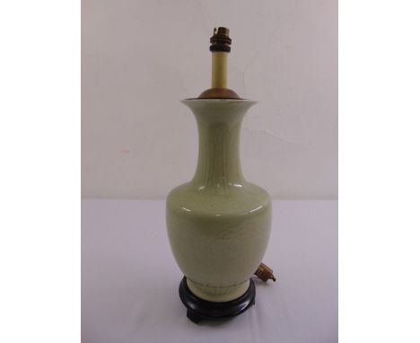 A Celadon baluster form lamp on turned hardwood base