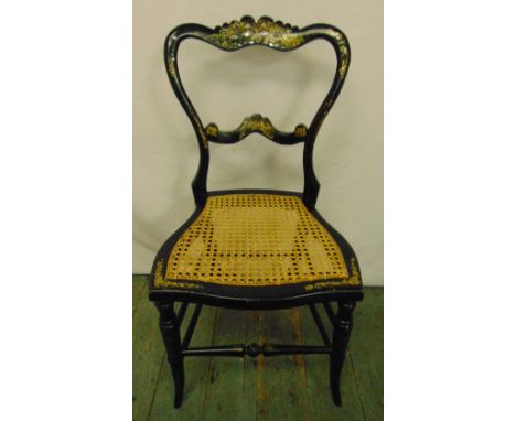 A 19th century lacquered mother of pearl inlaid boudoir chair with hand caned seat and ebonised frame