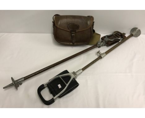 A vintage shooting stick "The Ideal Duchess" by Howell of London, together with one other. Plus a brown leather cartridge bag