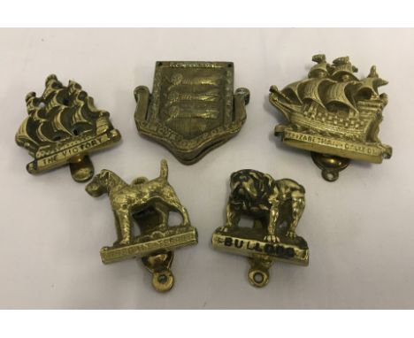 5 small brass door knockers. Comprising:- Bulldog, Airedale Terrier, Cinque Ports coat of arms, & 2 ships. 