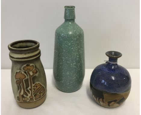 2 small studio pottery vases together with a mottled green glass bottle. One vase is by Canterbury Pottery. Vases measure app