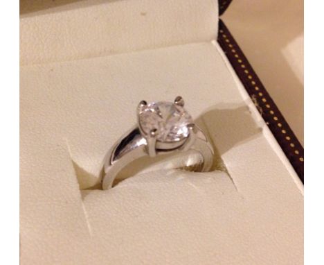 A hallmarked silver ring set with a large cubic zirconia.  Ring size approx K.